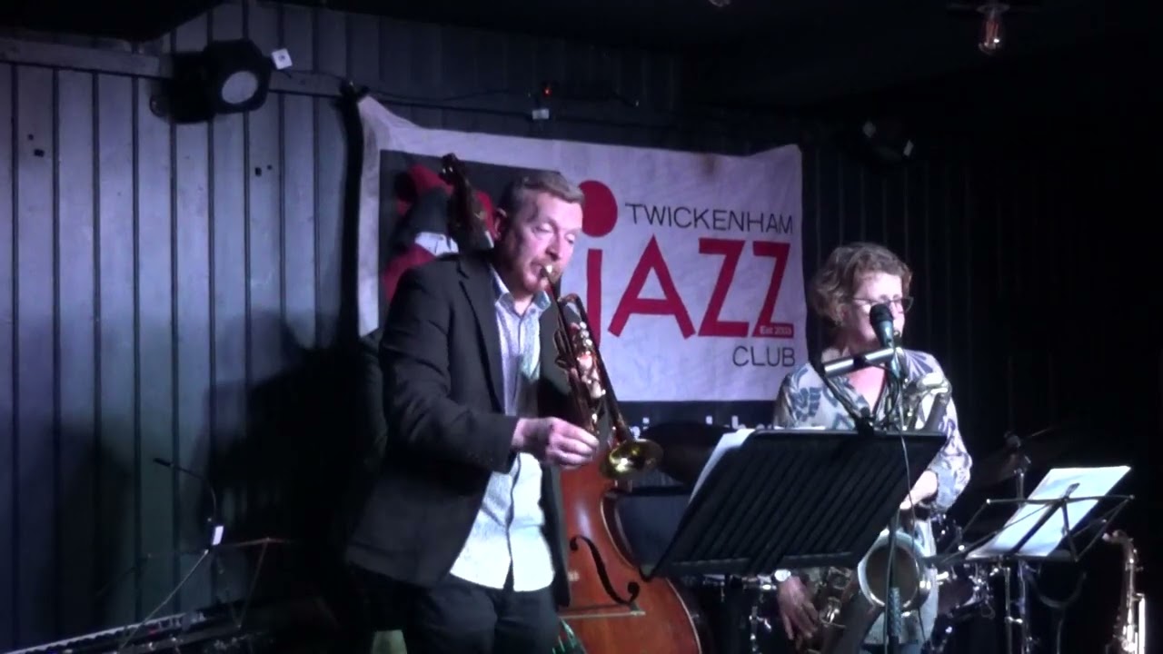 Stuart Henderson trumpet and Karen Sharp baritone saxophone combine on the opening for “Swing