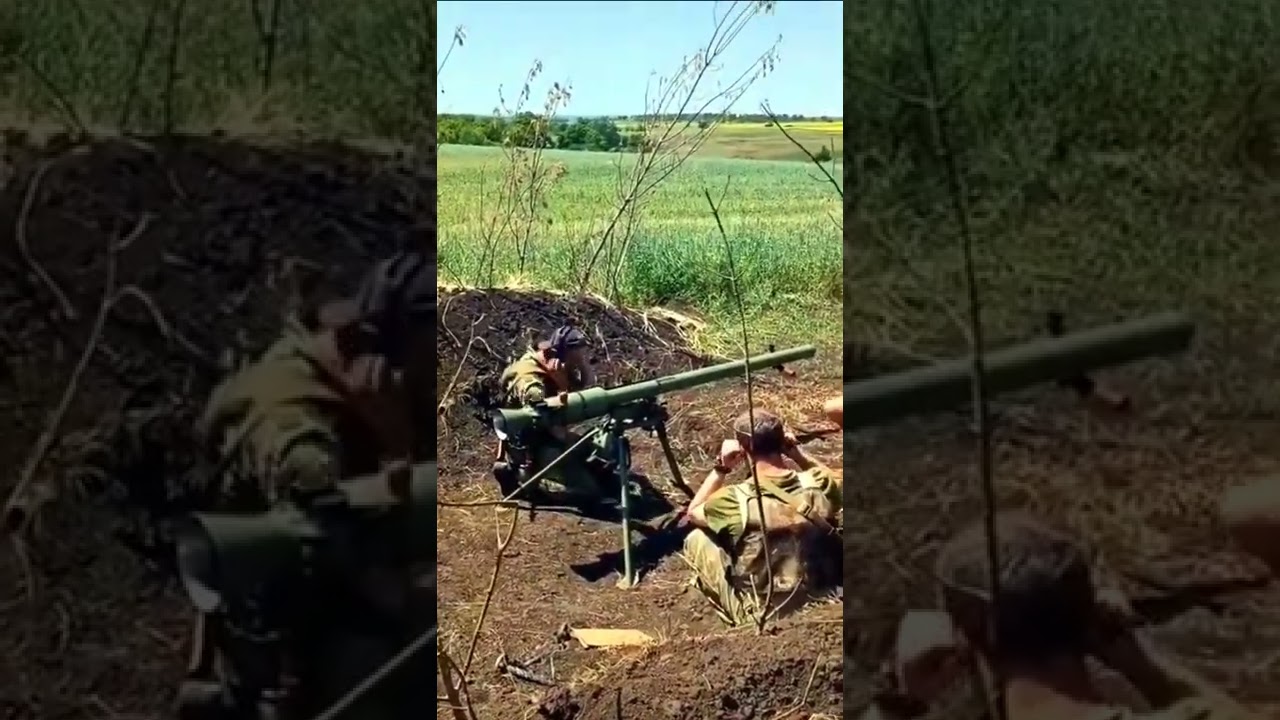 Ukrainian combatants using a SPG-9 'Spear' tripod-mounted 73mm recoilless gun