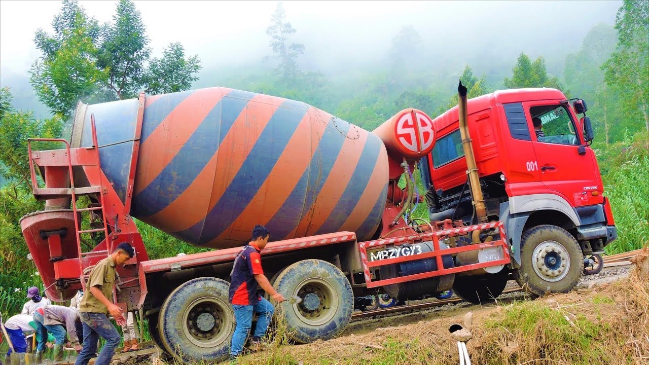 Ready Mix Cement Concrete Truck Paving The Steep Winding Road Quester CWE280