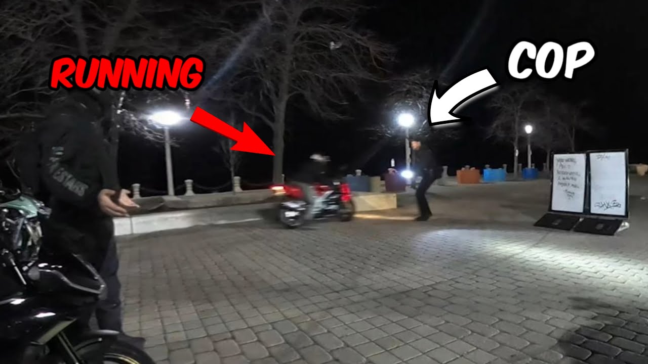 Cop tries TACKLING biker