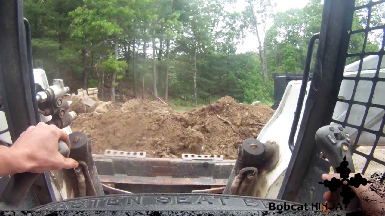 Bobcat A300 Loading Tri-Axle Dump Truck