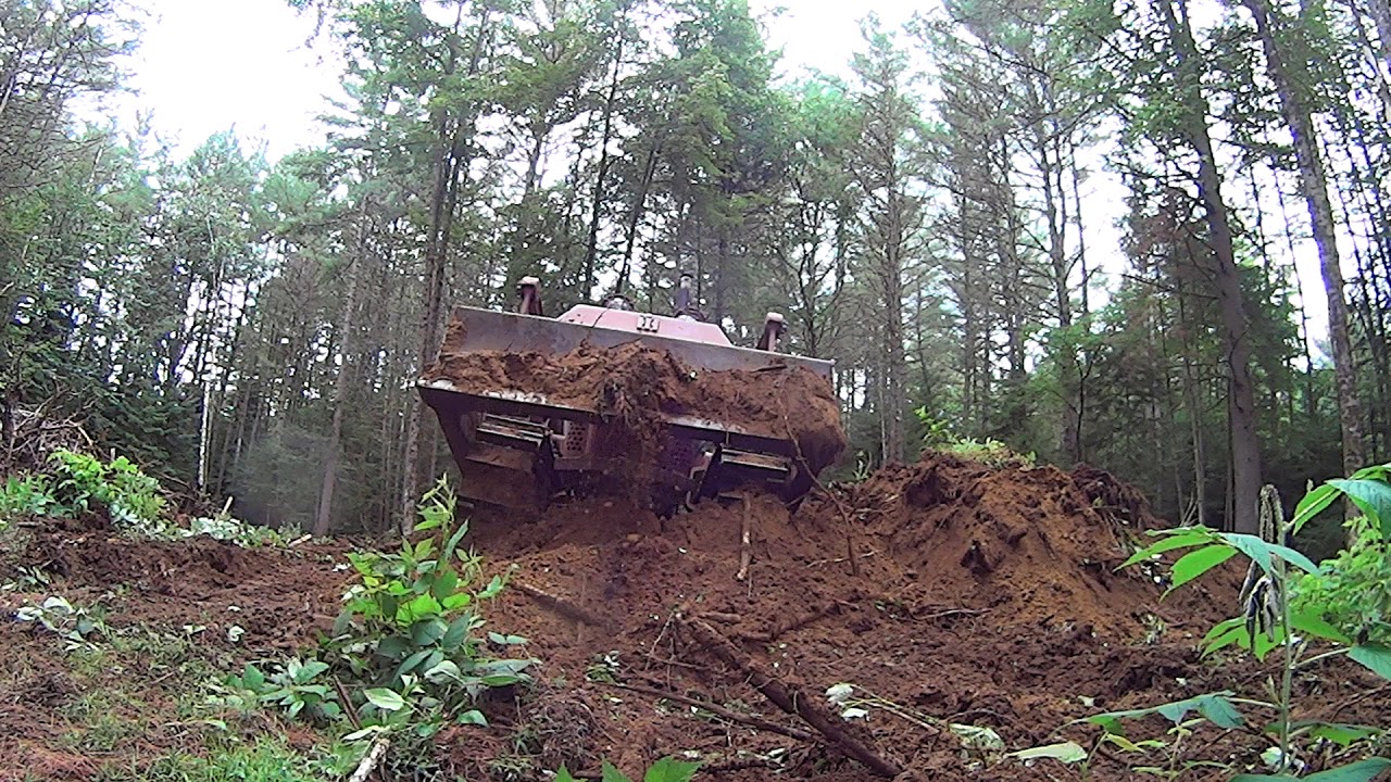 International T-6 Dozer pushing a big pine stump