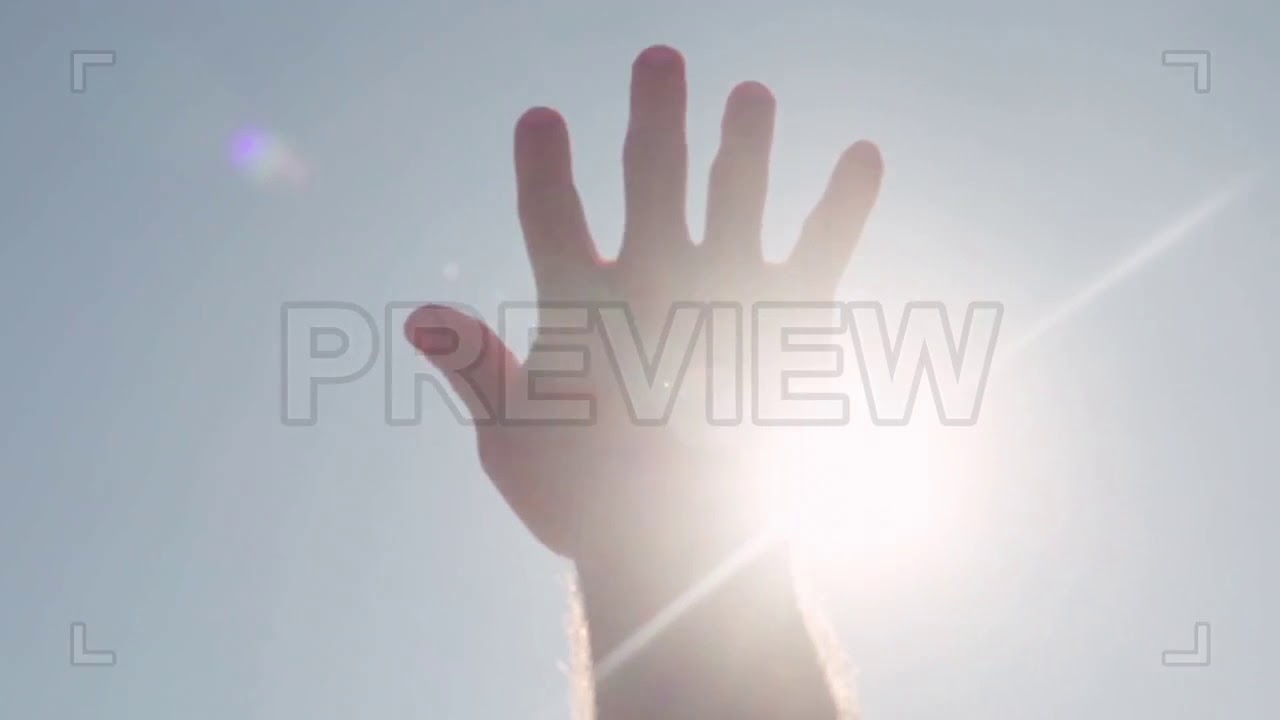 Hand Reaching For The Sun Stock Video