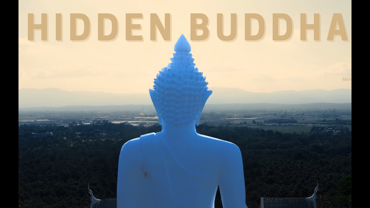 giant buddha statue carved into mountain - chiang mai