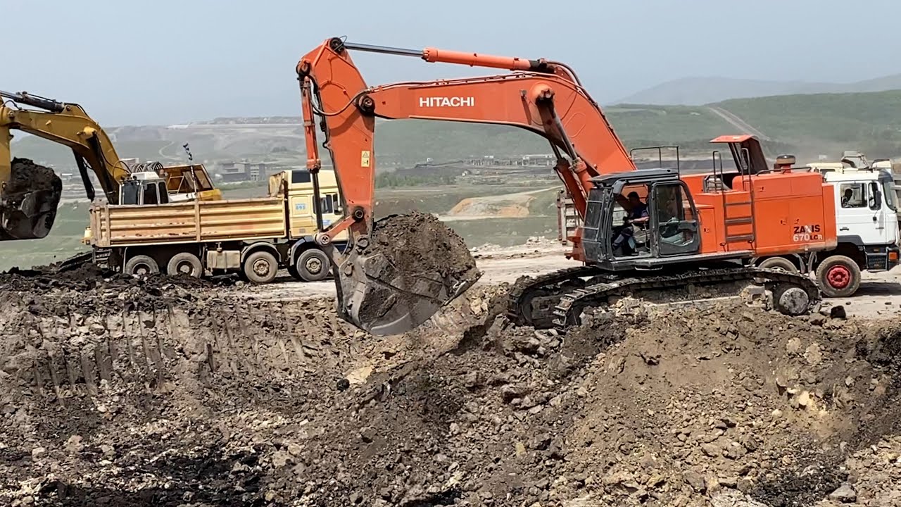 Hitachi Zaxis 670LCR Excavator Loading Trucks - Anogiatis