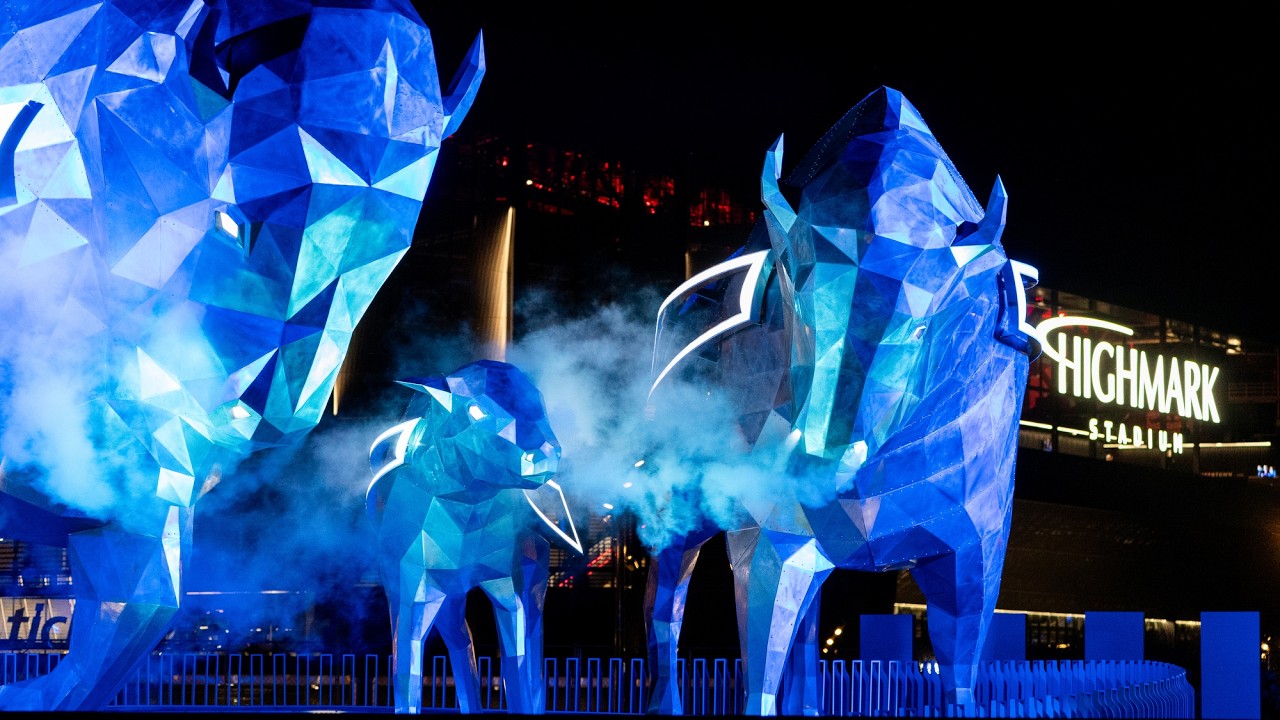 Crews light up the bison statues outside Highmark Stadium