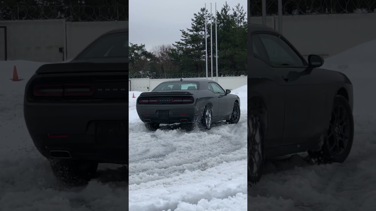 Dodge Challenger GT AWD. Wetsliding close up 2/3