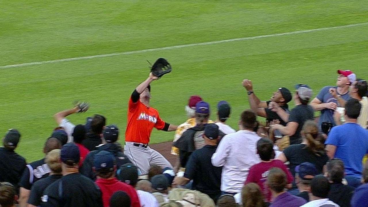 MIA@COL: LoMo tracks fly ball into stands