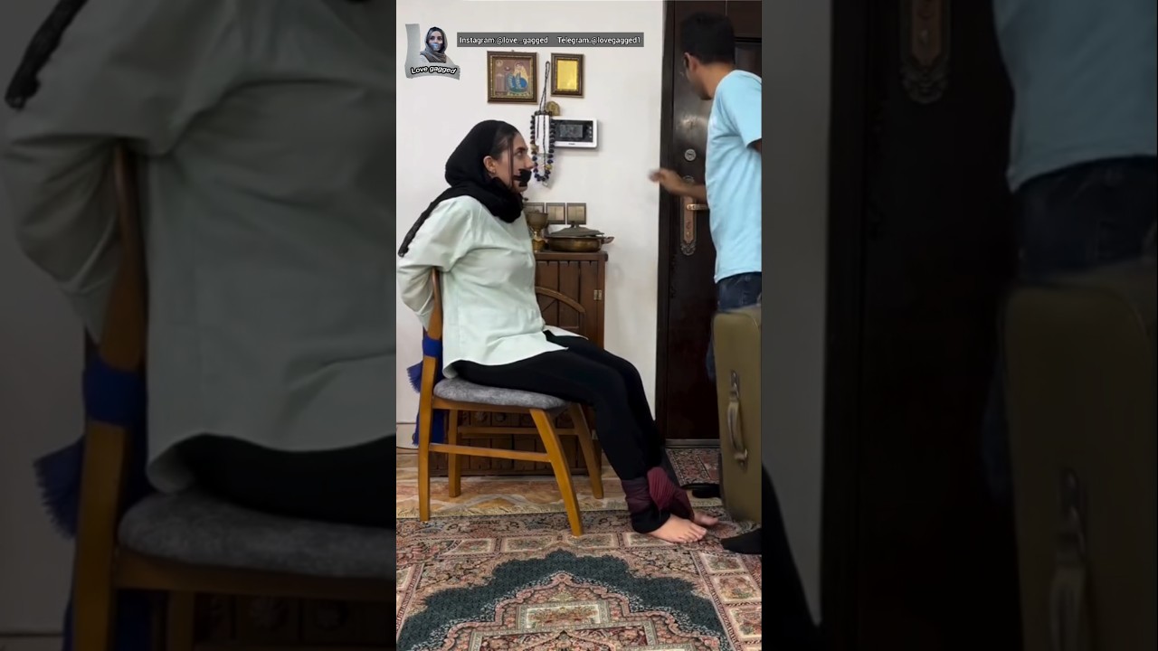 persian woman tape gagged and tied up to chair
