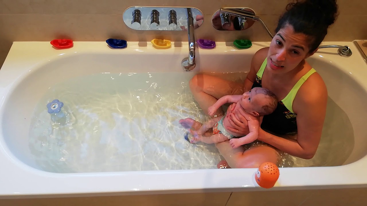 Home baby swimming in the bath tub/2
