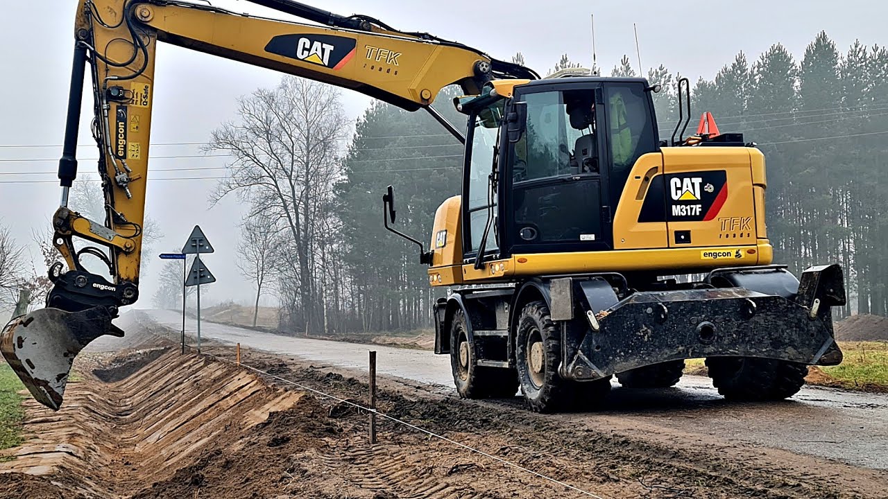 Cat M317F tiltrotator Engcon - rowy i zjazdy na działki