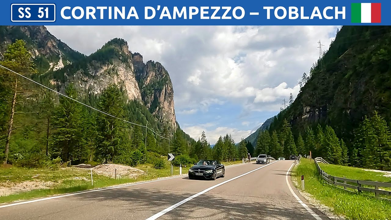 Driving in Dolomites, Italy. Road from Cortina d'Ampezzo to Toblach (Dobbiaco). 4K