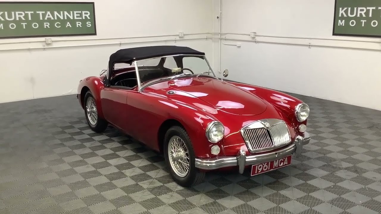 1961 MGA 1600 MK1 ROADSTER. METALLIC WINE RED WITH BLACK TRIM, BLACK CLOTH TOP AND TONNEAU COVER.