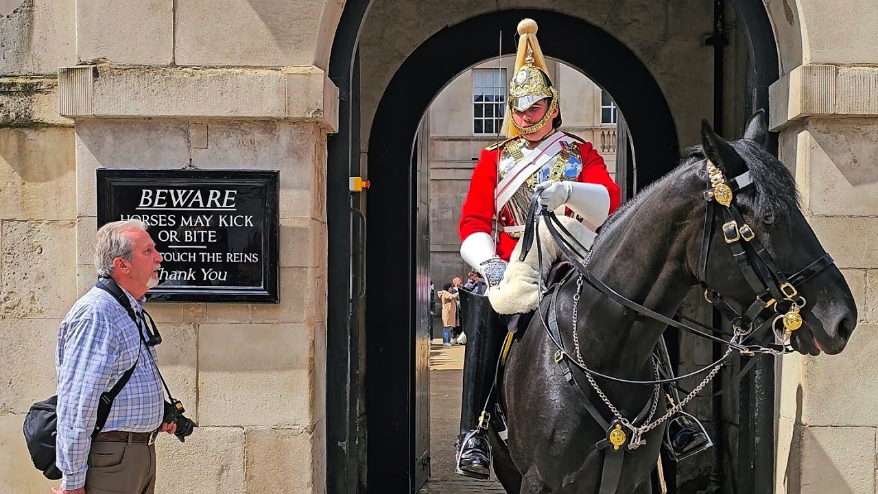 IDIOT US TOURIST INTERRUPTS THE GUARD CHANGE - Guard says get behind the bollards at Horse Guards!