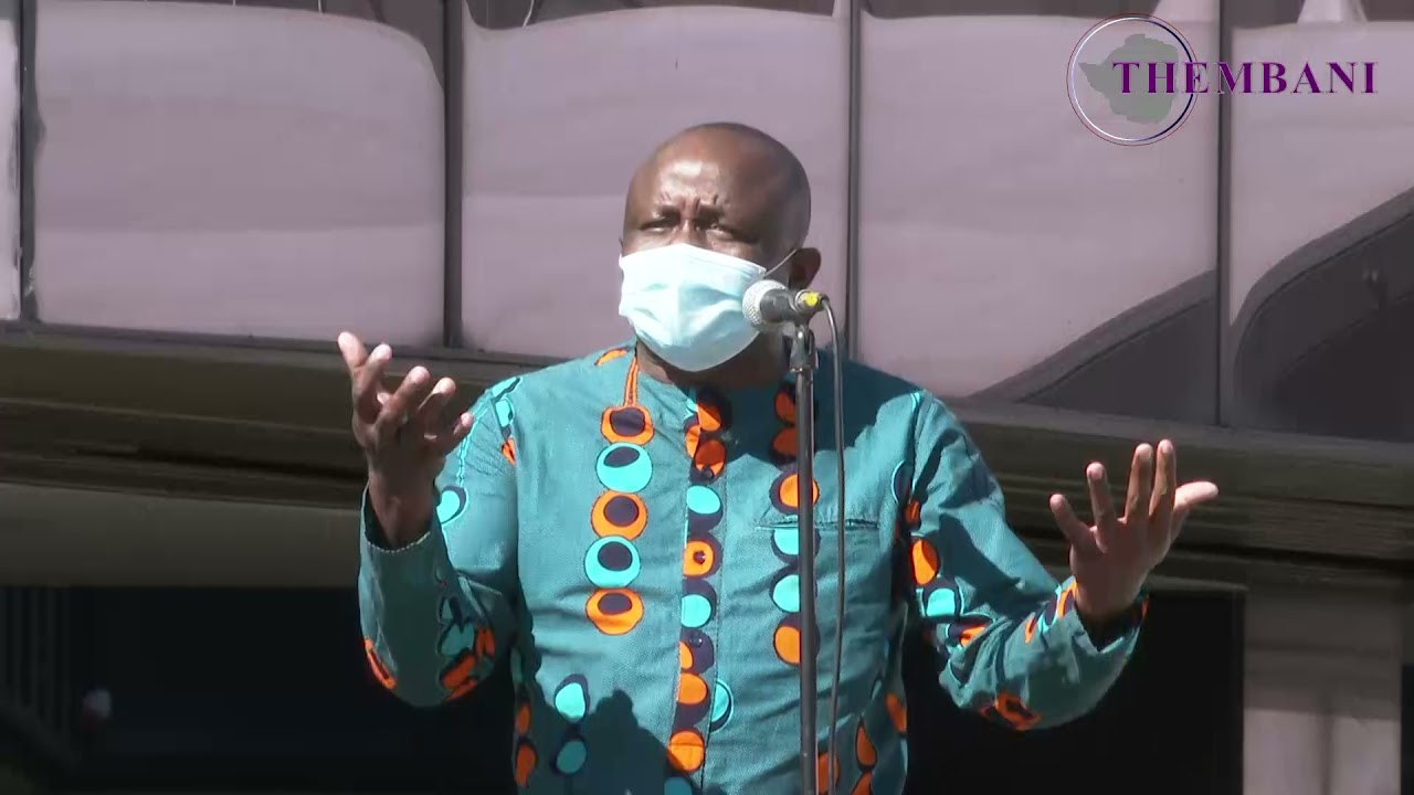 Tatenda Chinoda reciting the poem 'Nehanda Nyakasikana' at  the Mbuya Nehanda effigy unveiling.
