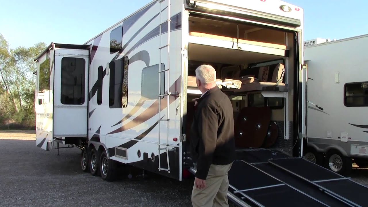 Preowned 2012 Dutchmen Voltage 3950 Fifth Wheel Toy Hauler RV - Holiday World Katy, Texas