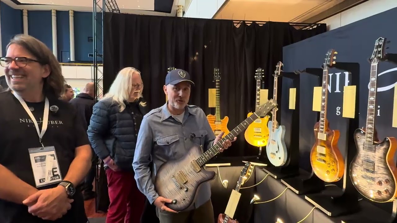 Guitar Summit 2025 Best Booths : Nik Huber with Art of Guitar CEO showing off the newest releases