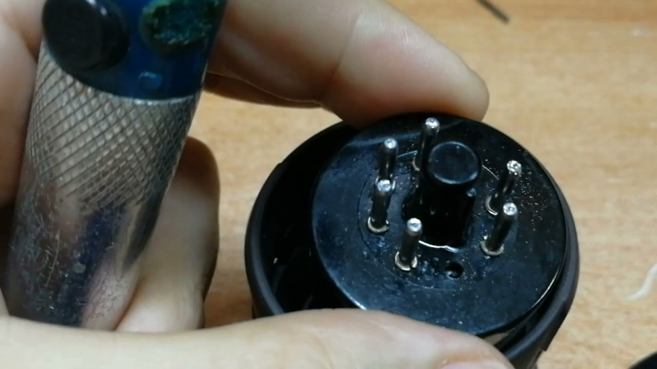 Re-soldering pins of radio tubes with octal base.