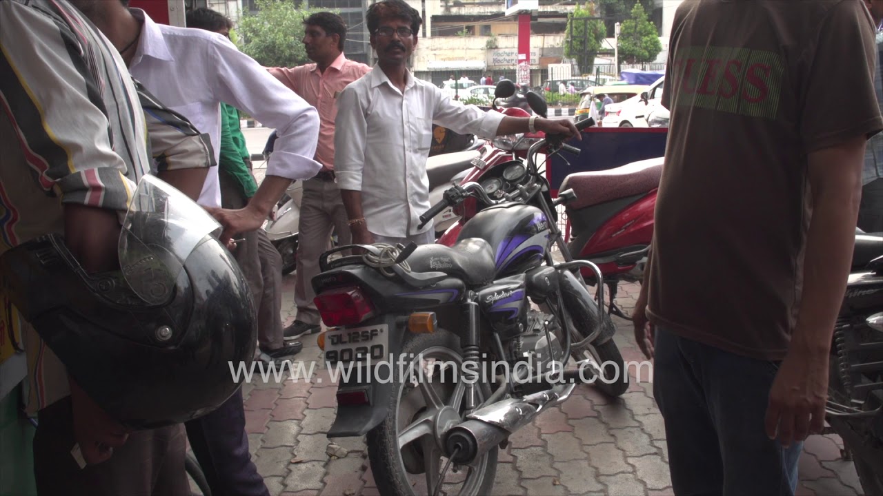A motorist with his new Pollution Under Control certificate