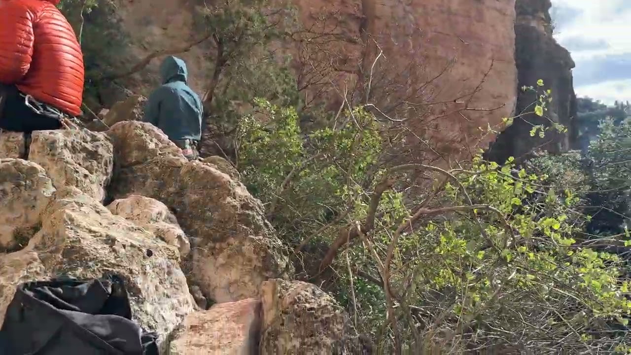 Waiting for our turn on Crosta Panic (7a+ = 12a) in Siurana, Spain