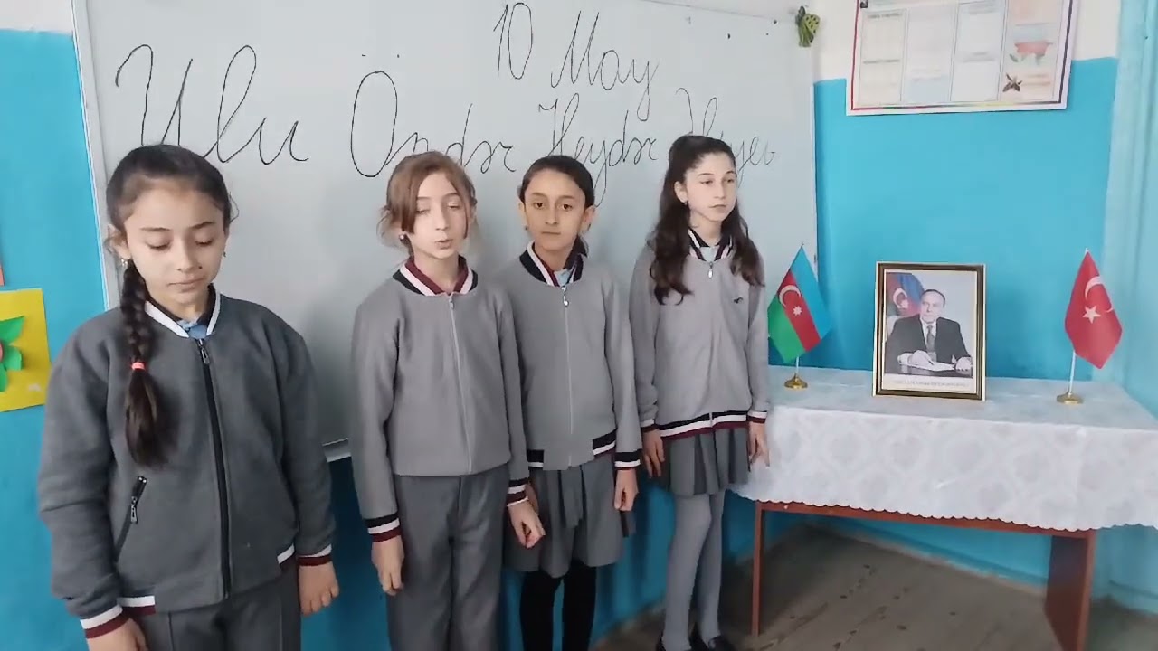 Quba rayonu ll Nügədi kənd 2 saylı tam orta məktəbin 4b sinif rəhbəri Ziya Əmrullayev və şagirdləri.