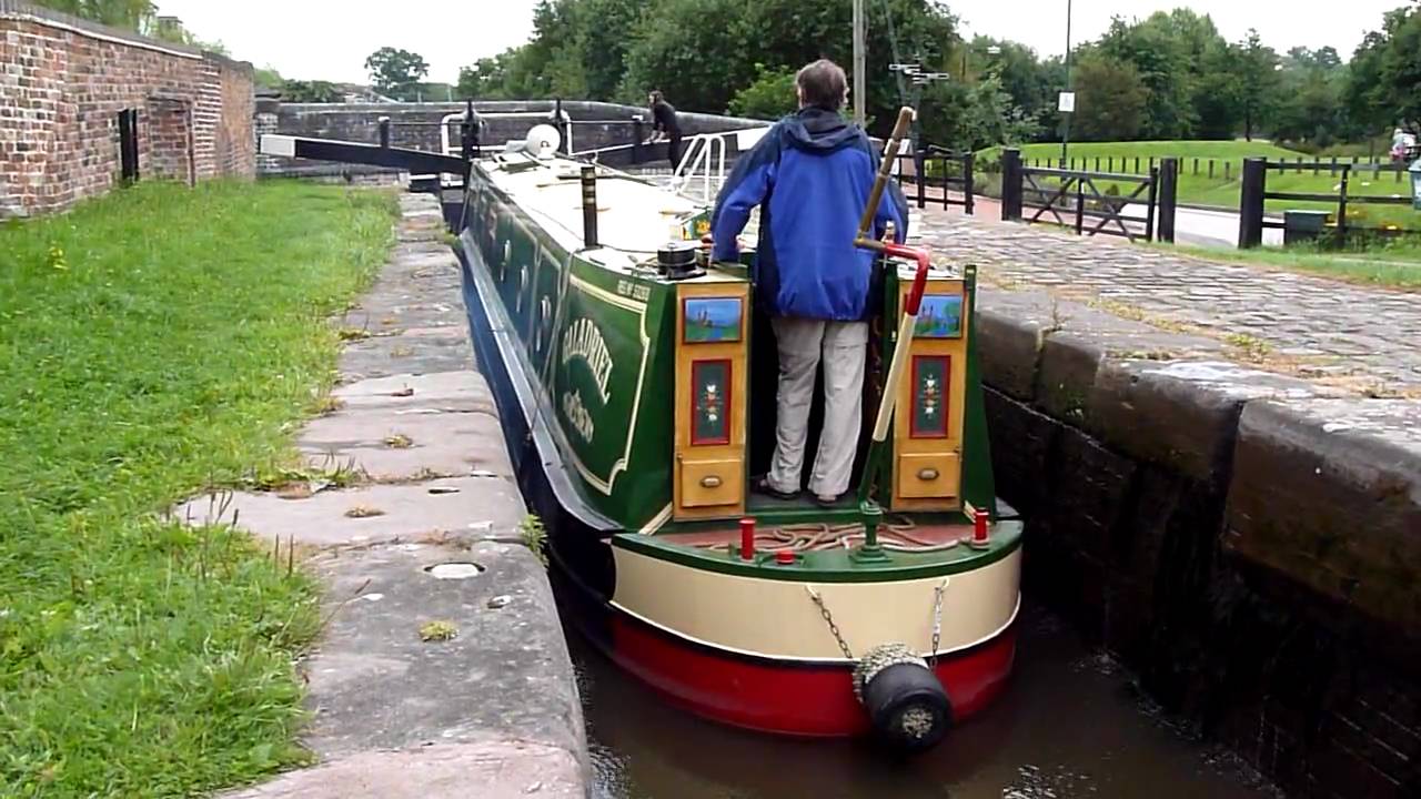 English Canal Narrowboat going through a Lock in Stone Staffordshire August 2010 by Workhouse Bridge