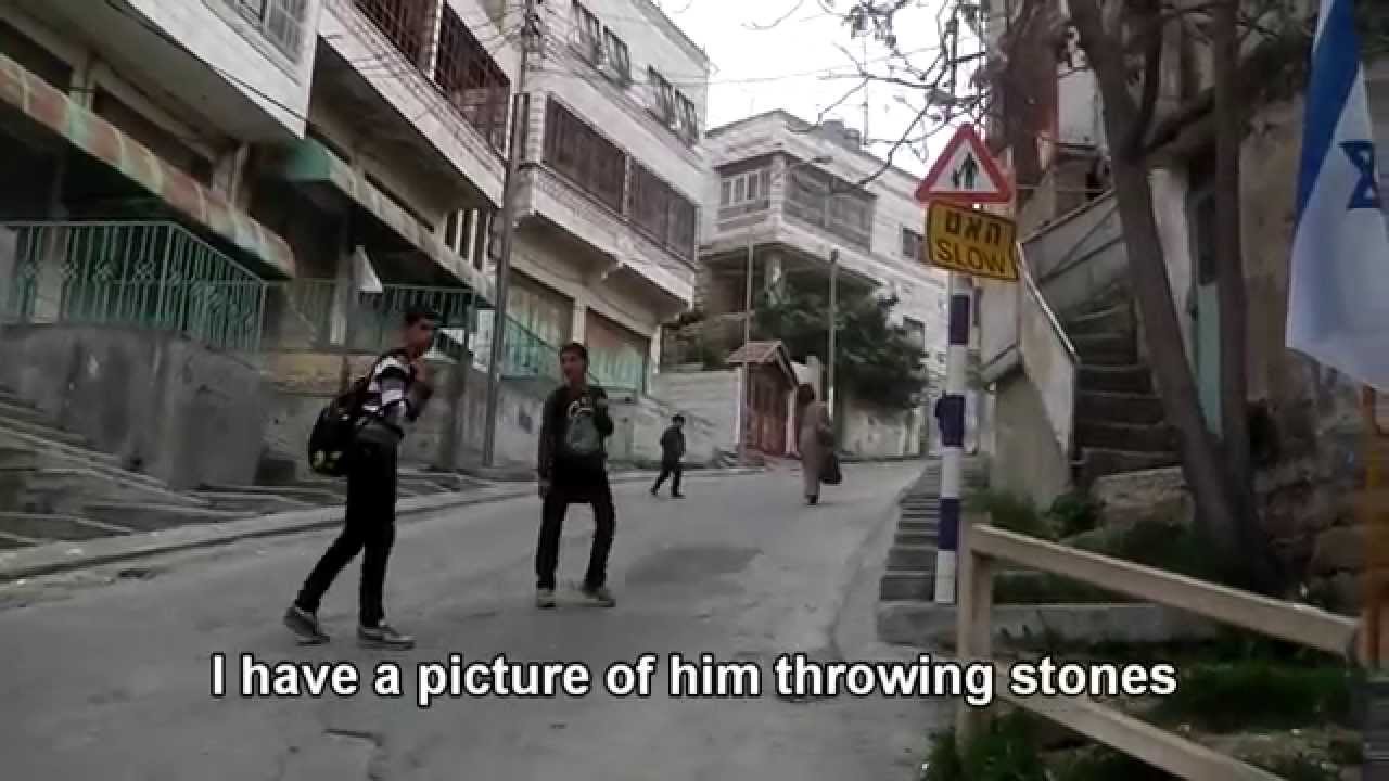 Hebron: Palestinian kids throwing stones at soldiers