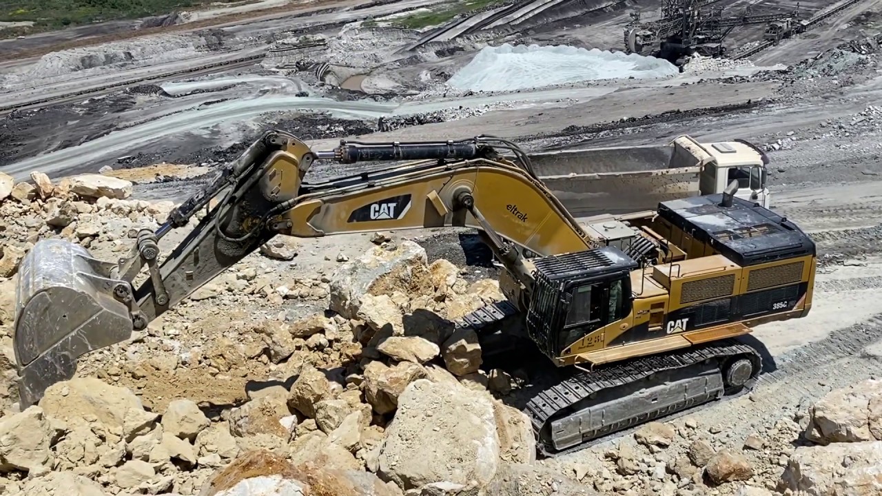 Caterpillar 385C Excavator Loading Caterpillar 775 Dumper And Trucks - Pyramis Ate