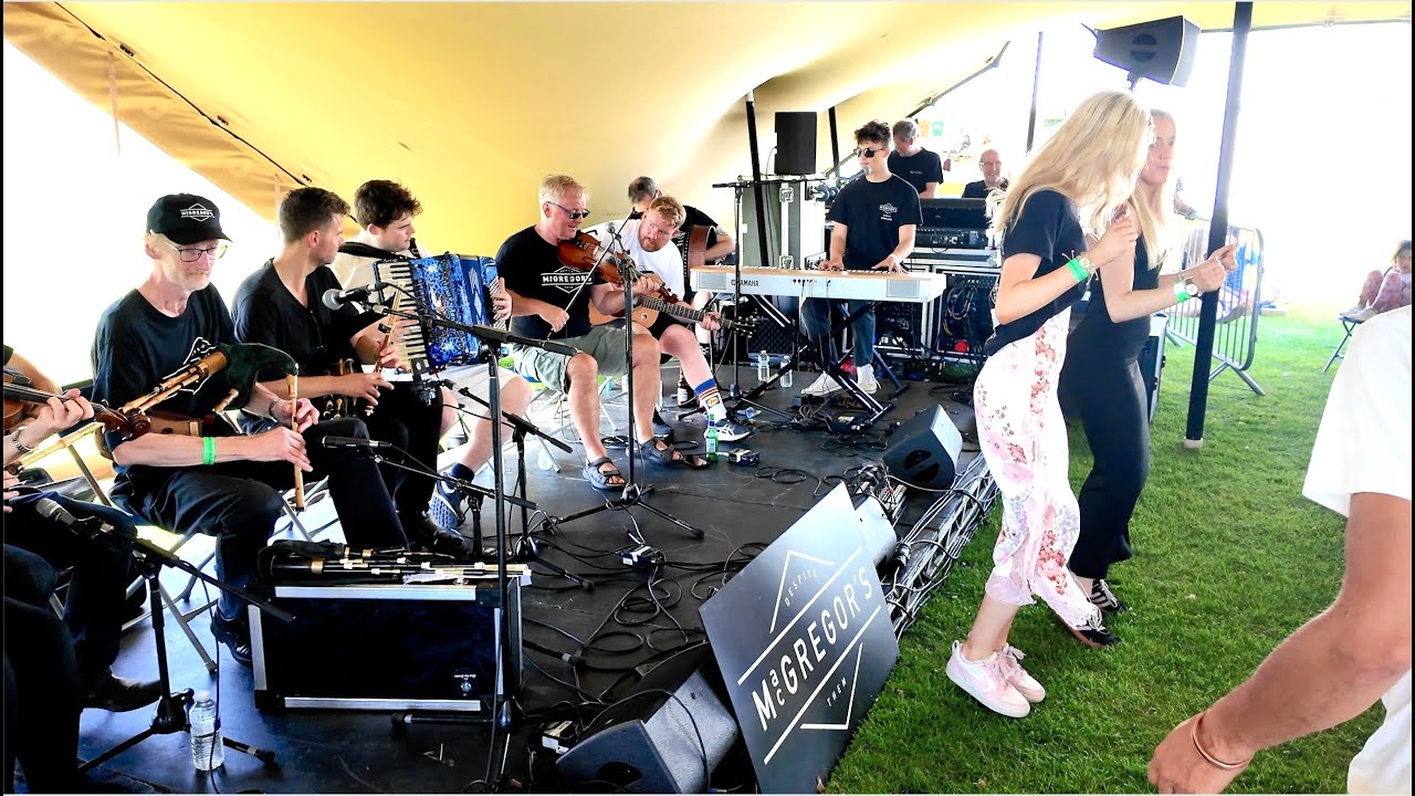 Bruce MacGregor leads MacGregors Gathering session in the Music tent at 2025 City of Inverness Games