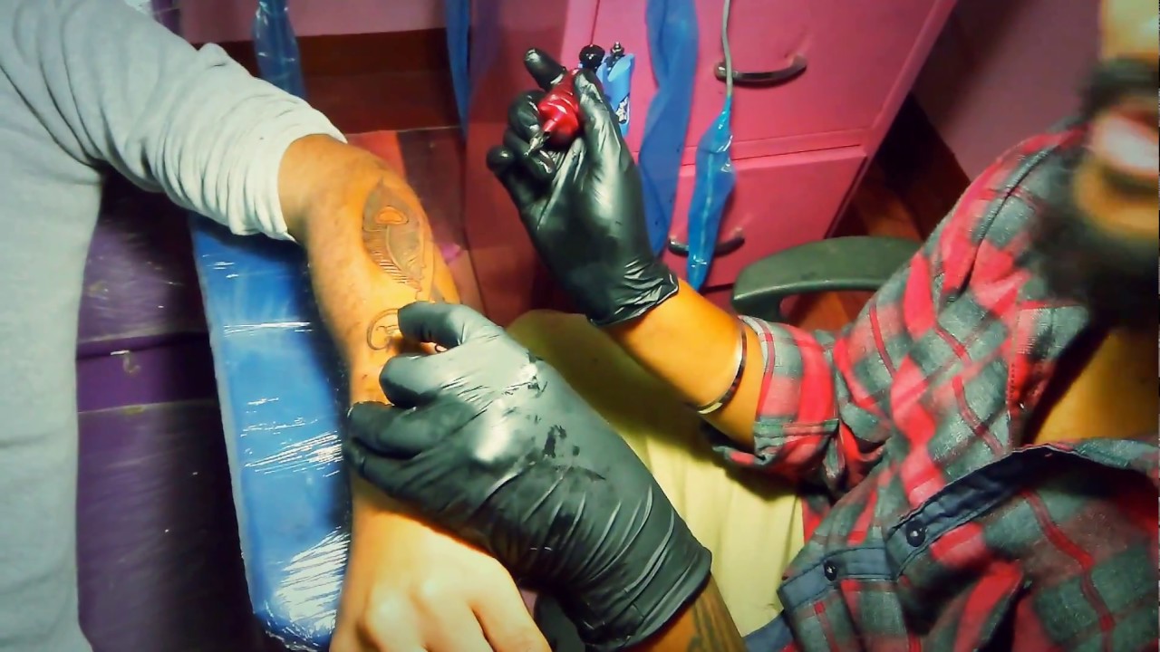 Peacock feather and flute tattoos processing