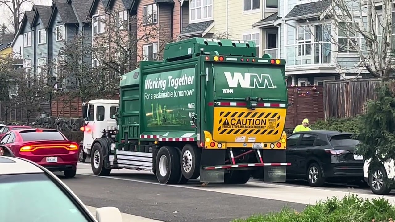 Two Waste Management Garbage Trucks + Metro 6051 traveling South