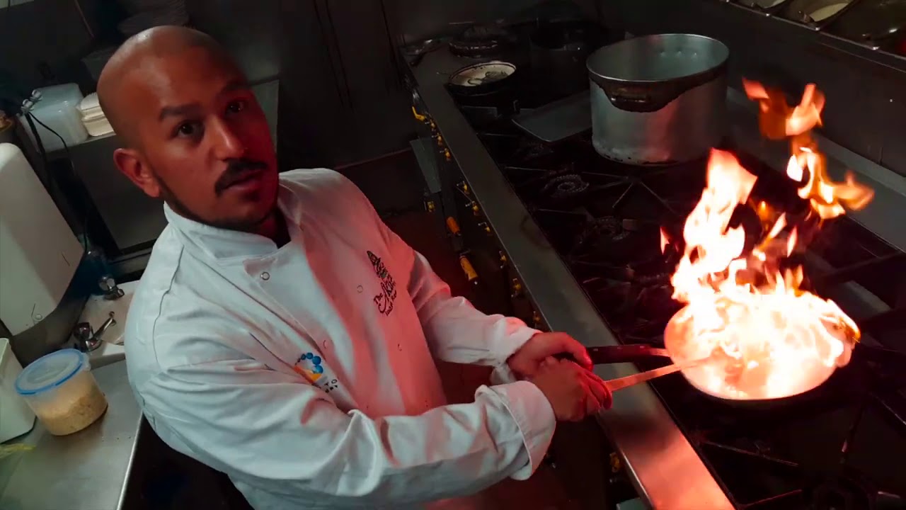 COOKING A CURRY WHILE THE PAN IS ON FIRE.