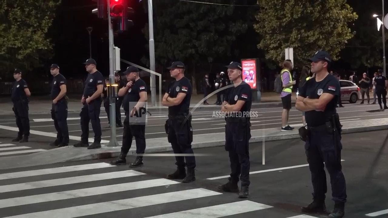 Tens of thousands of anti-government protesters march in Belgrade