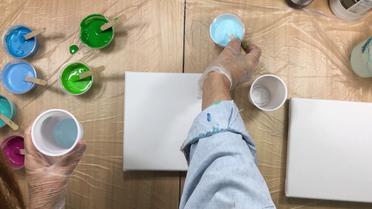 ( 223 ) 2 acrylic pours reverse colours in the cup.