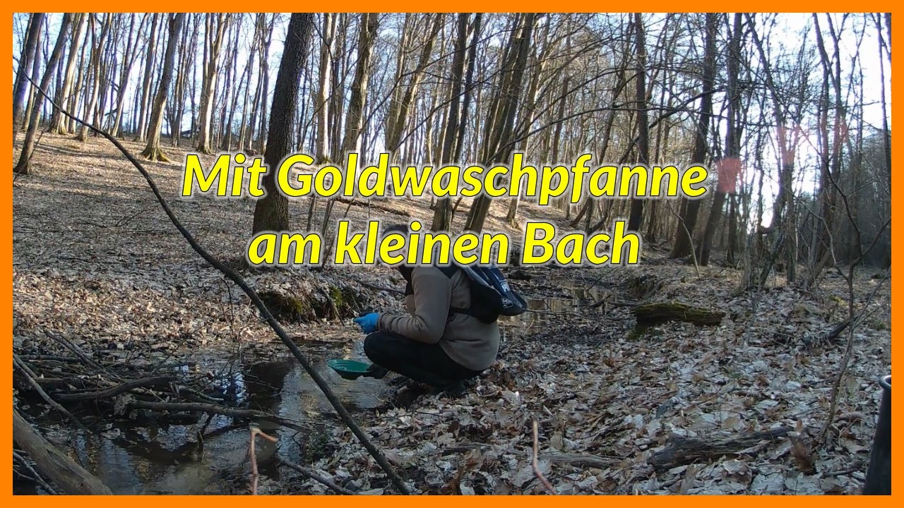 Mit der Goldwaschpfanne am kleinen Bach