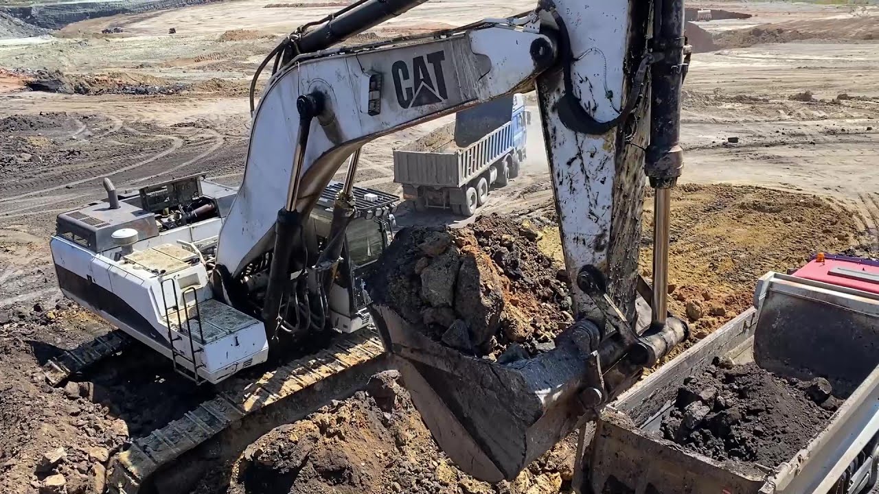 Caterpillar 375 Excavator Loading Mercedes & MAN Trucks