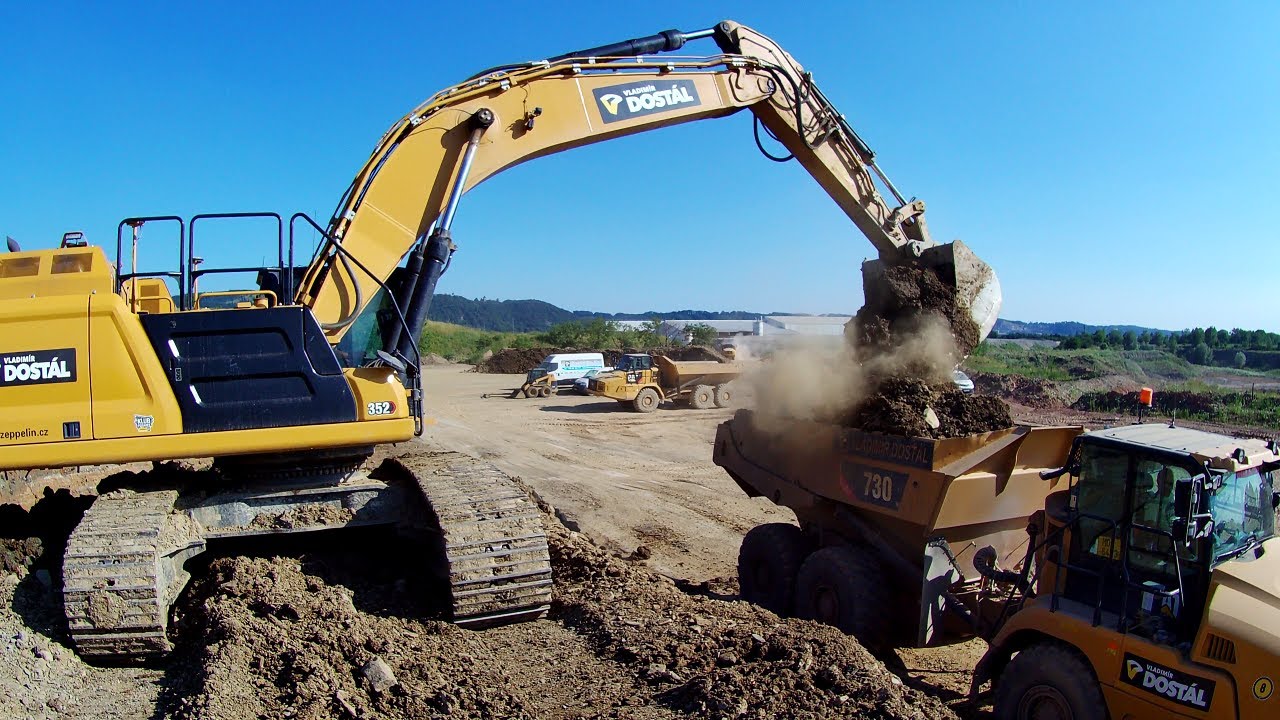 CAT 352 loading dump trucks CAT 730C
