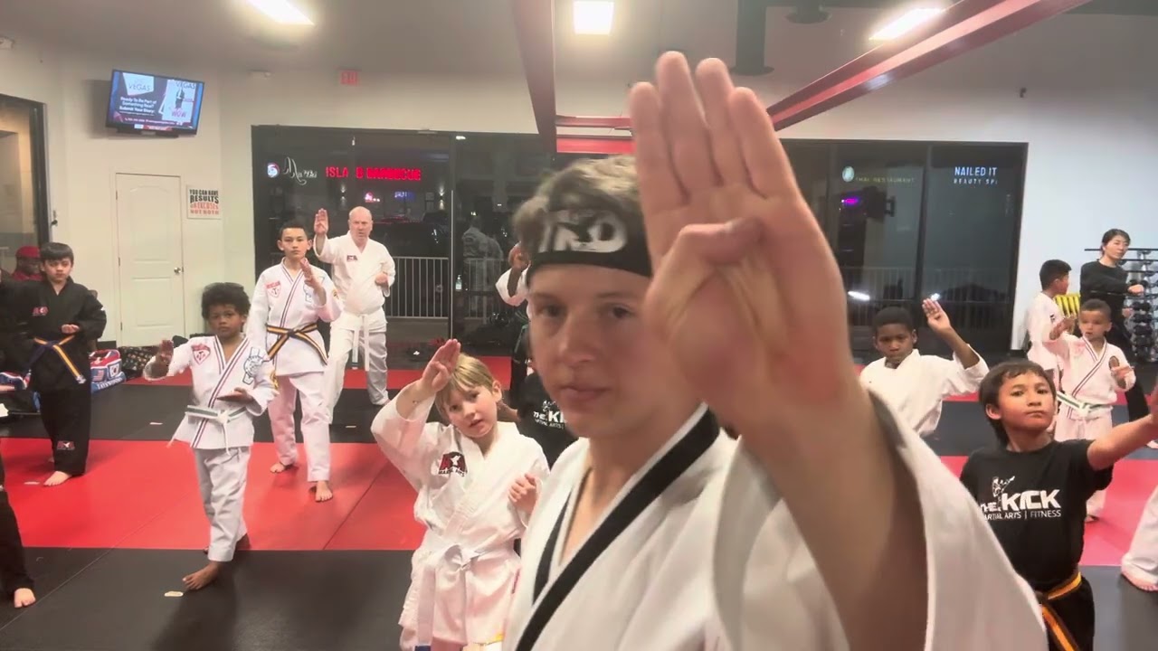 Teaching reverse Ridge Hand strikes 