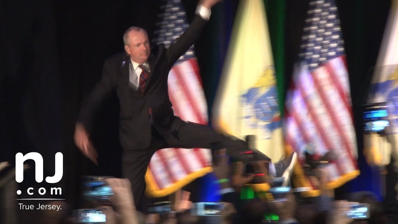 Phil Murphy leaps onto the stage for victory speech