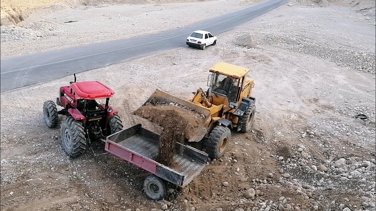 Loading soil mixture with loader and tractor 