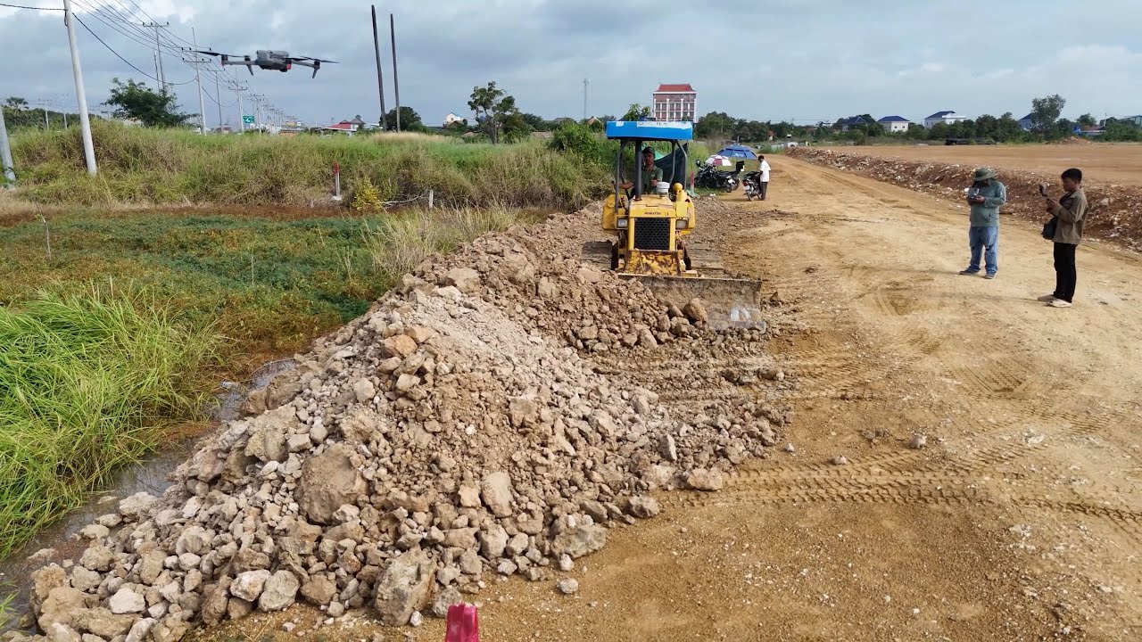 Land Filling Operation in Progress Skilled Dozer & Dump Truck Drivers Moving Stone and Soil Smoothly