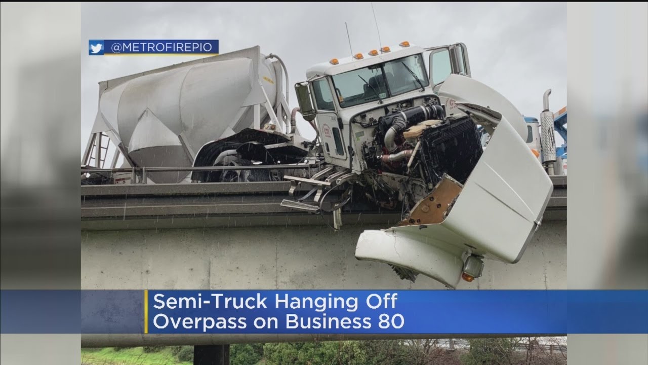 Semi-Truck Crashes, Hangs Off Overpass On Business 80