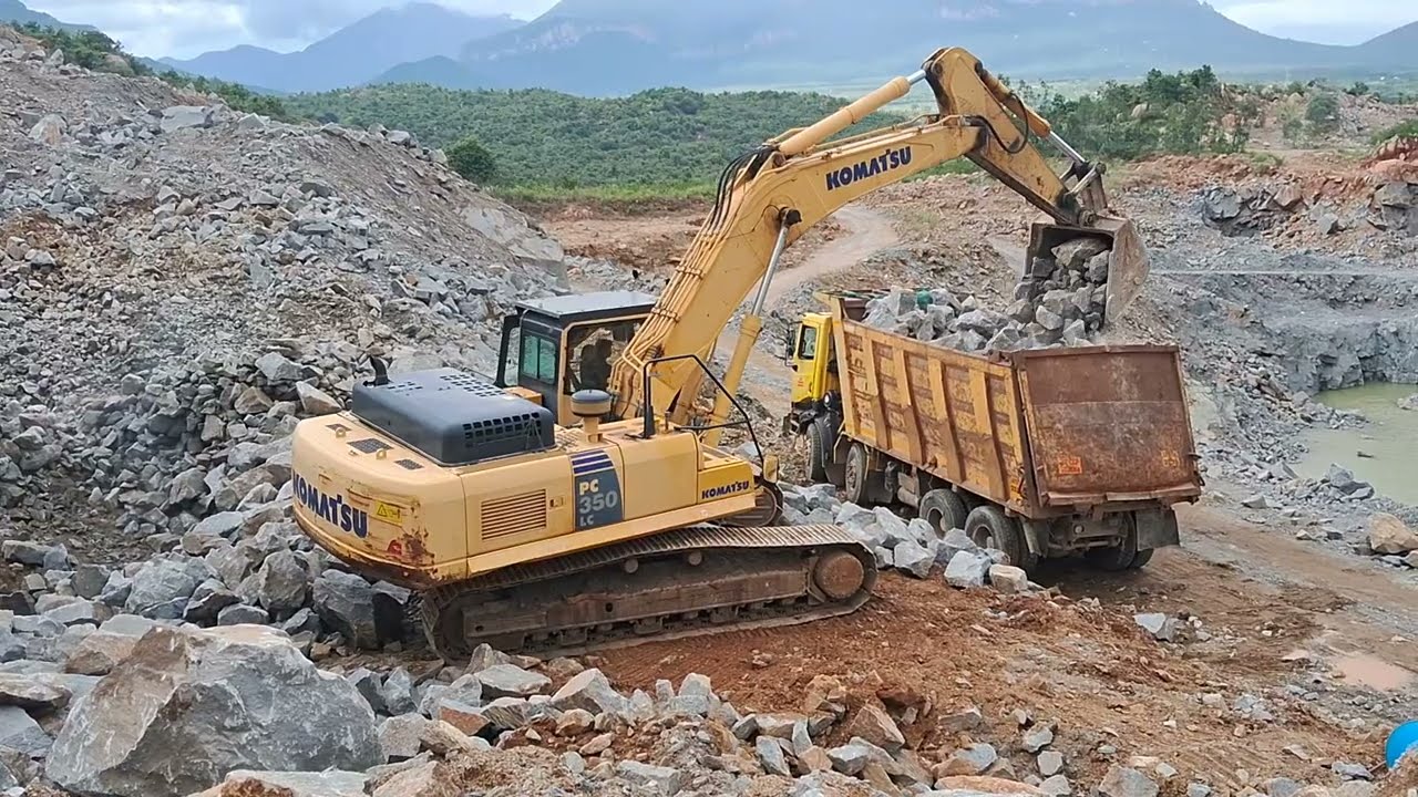 Komatsu pc-350 12tyre tipper loading 
