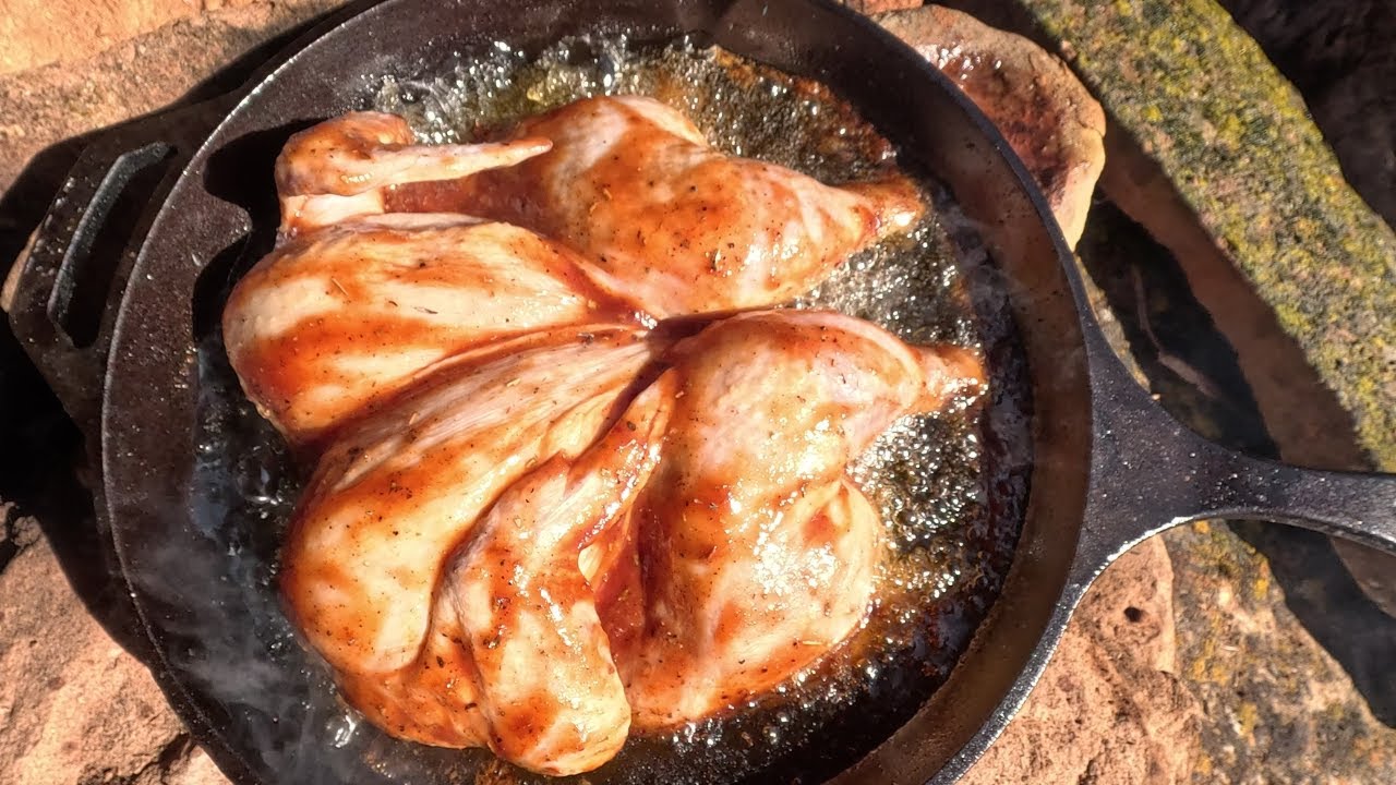 Worlds Best BBQ Chicken Fried on a cliffside fire pit.