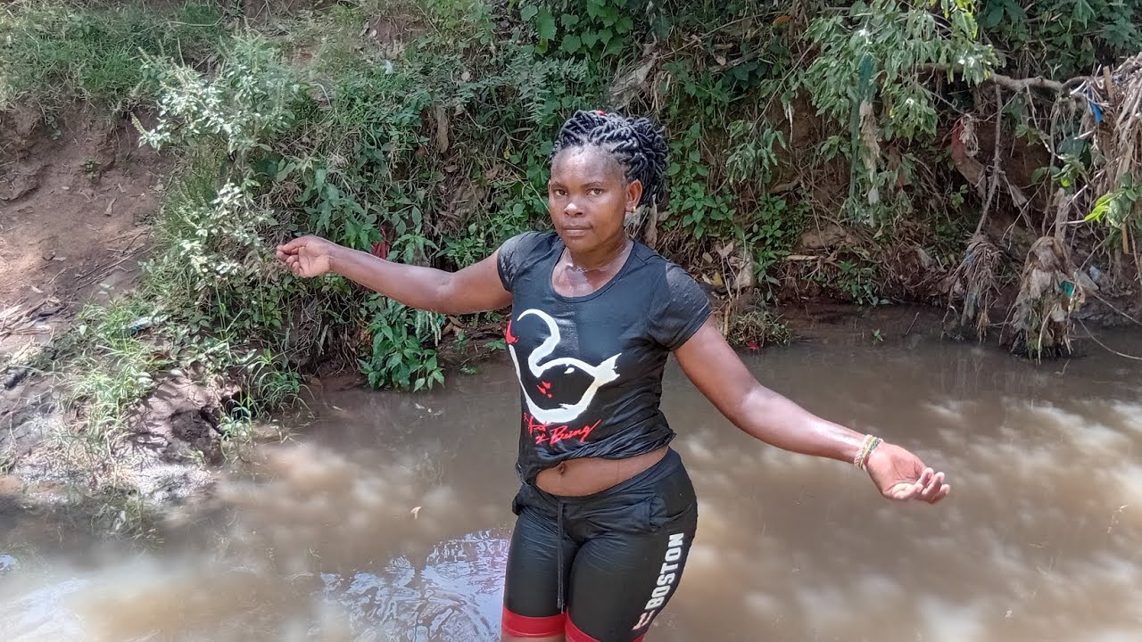 TAKE  A BATH  TO THE RIVER  AND ENJOYING  TO SWIM WITH  SOME KIDS 