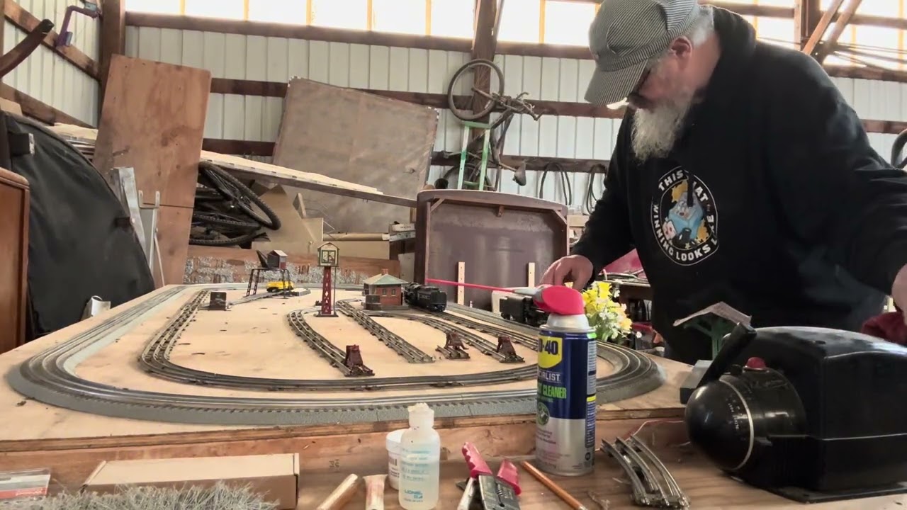 Wanna play with my trains!  Cleaning up the layout. 