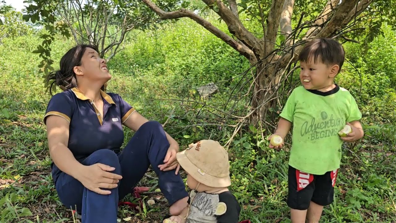Mom took her two children to pick fruit to sell so they could have money to buy shoes for their