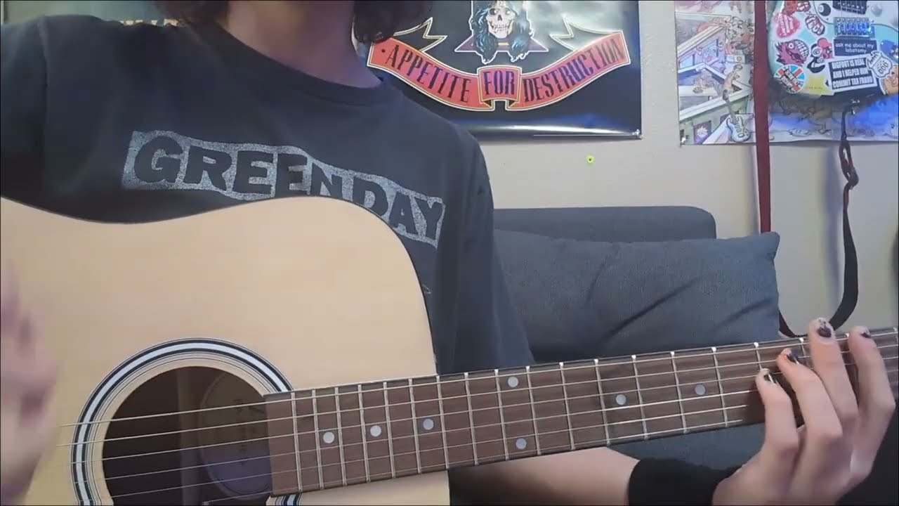 How To Hold A Guitar