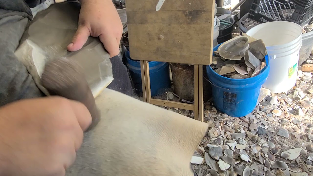 Spalling and bifacing a large flint nodule