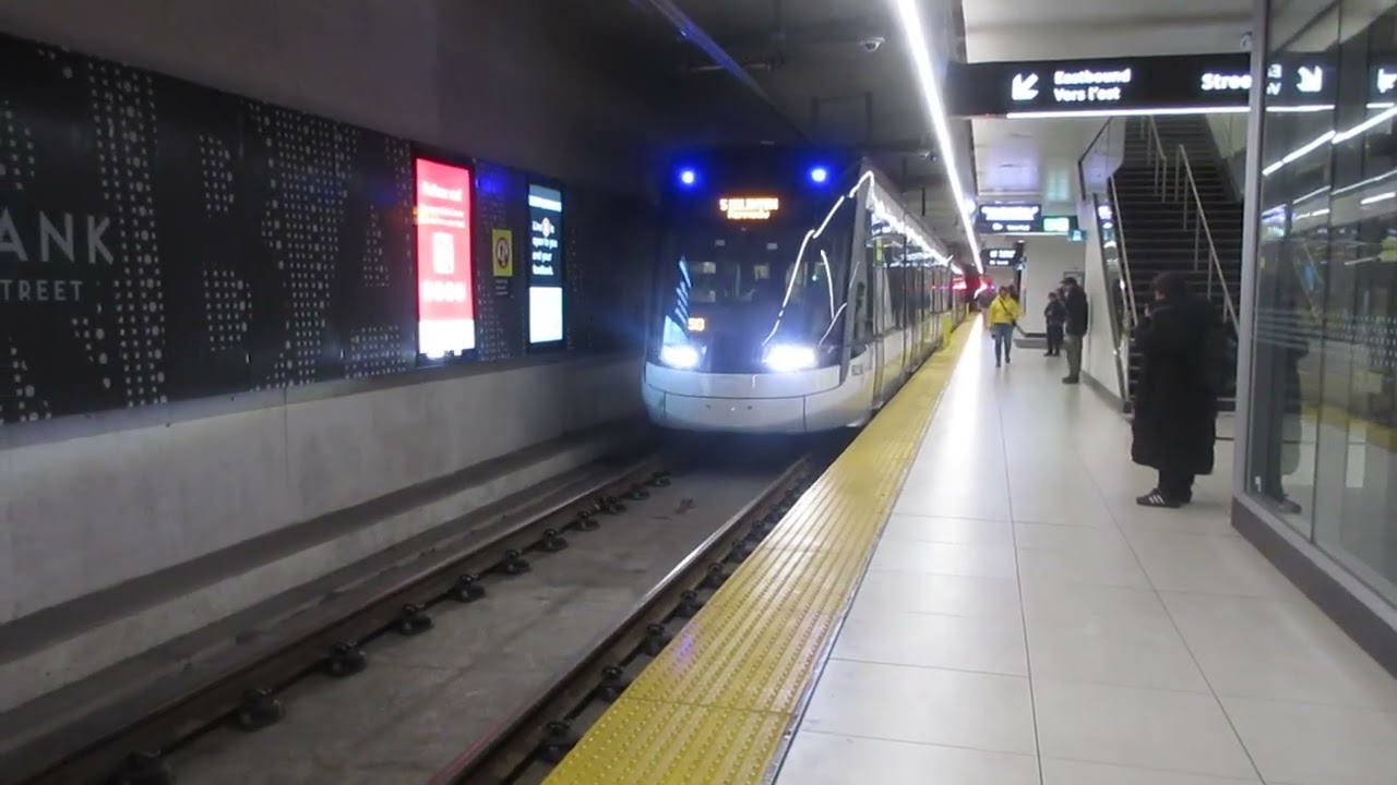 Flexity Freedom LRVs 6230 and 6244 arriving and departing Fairbank (Dufferin)  Station